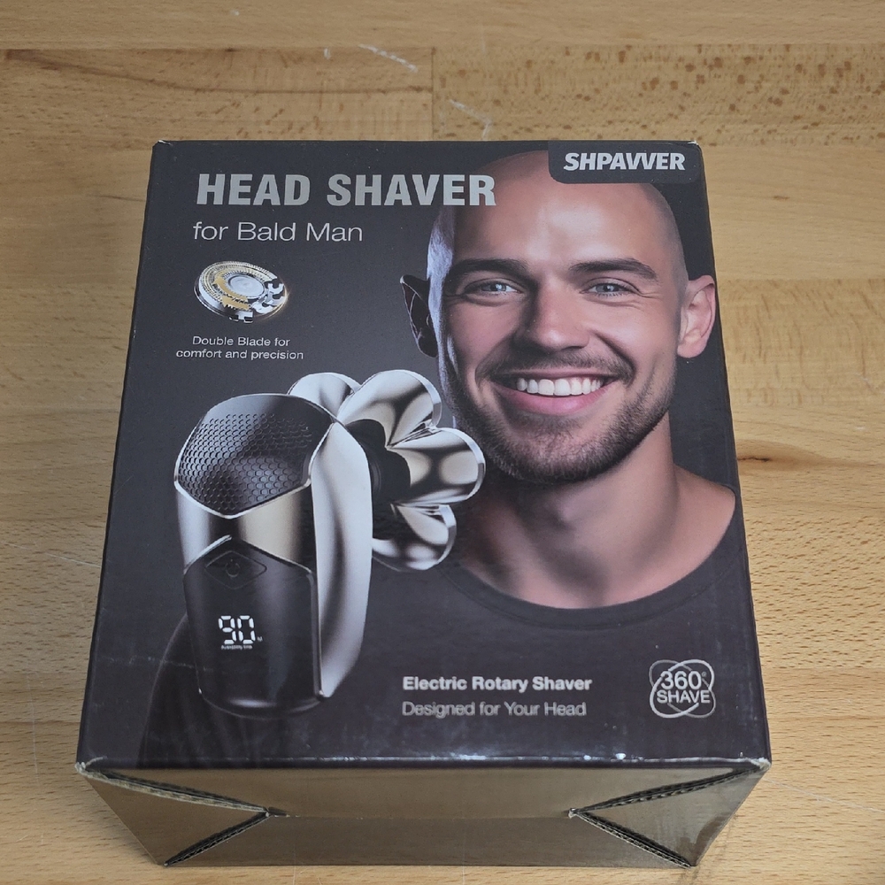 Have Black and Silver Electric Rotary Shaver